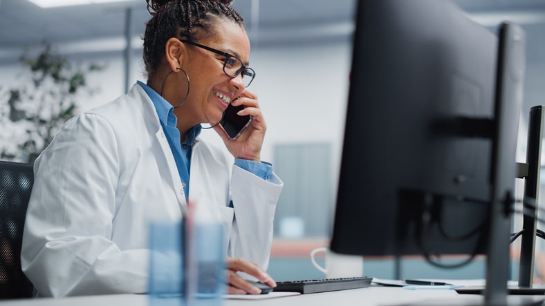 A dermatology billing team reviewing revenue cycle reports